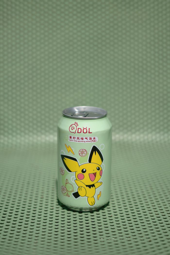Anime-themed beverage can featuring a cute character on a textured green background.